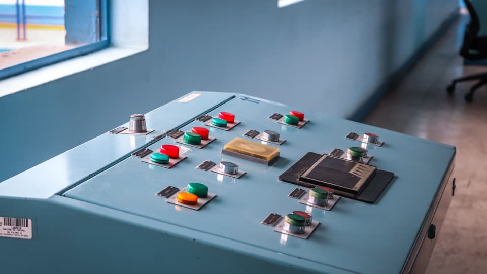 Push-buttons and indicator lamps on an industrial control panel