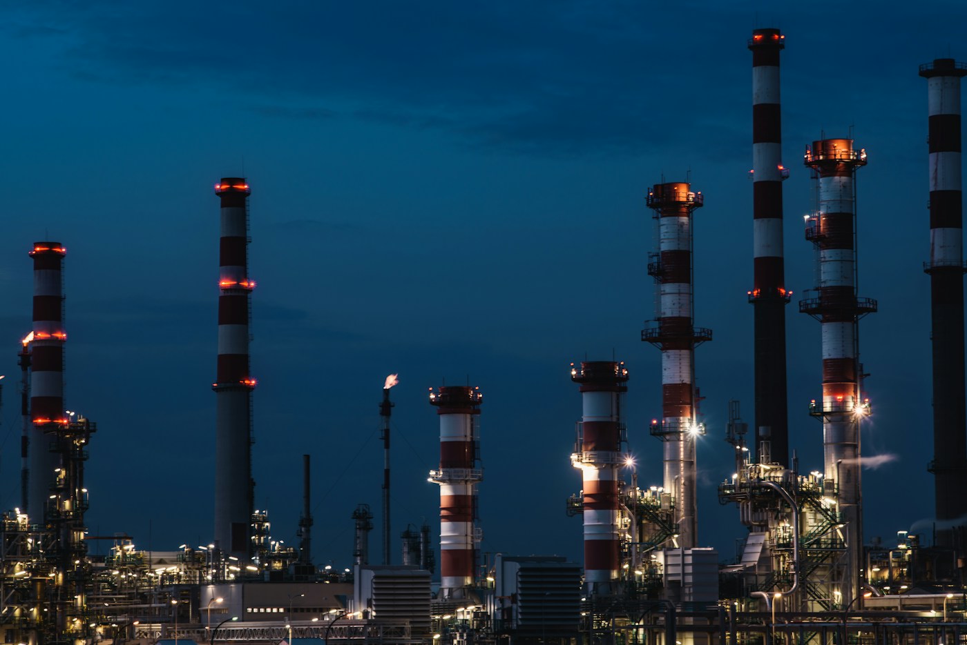 Distillation columns at a refinery at dusk